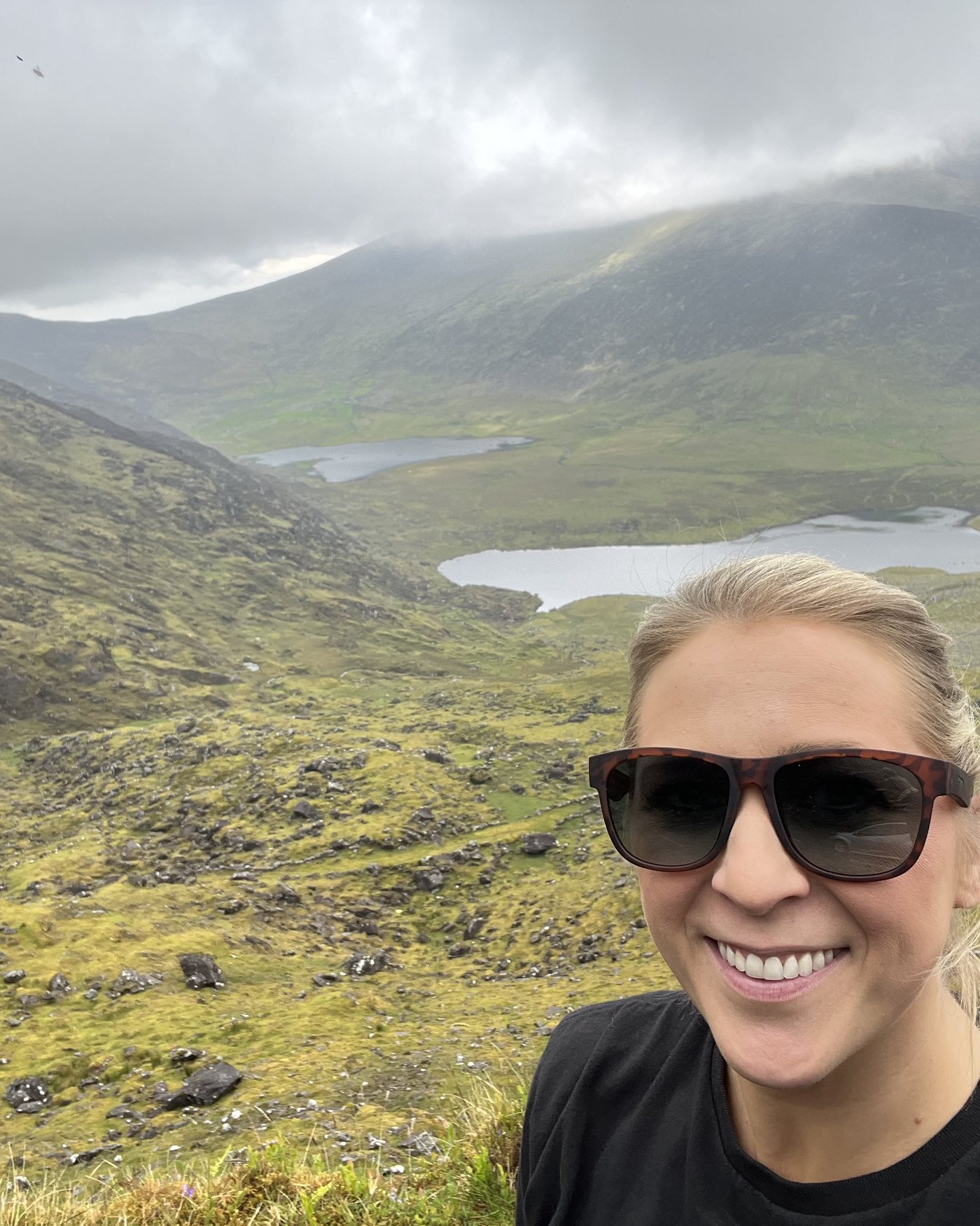 Jenny above a green valley in Ireland